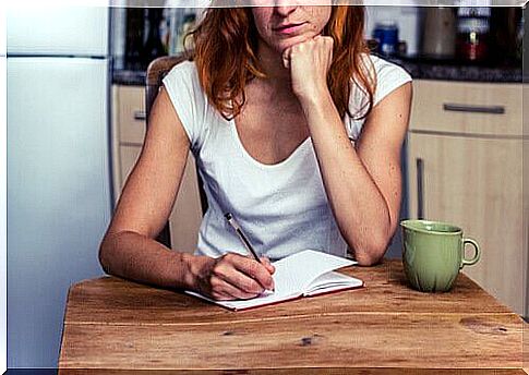 woman making a list of things to do to fight emotional exhaustion