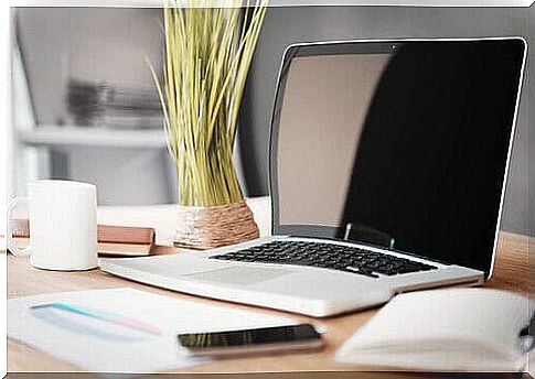 desk with computer and smartphone