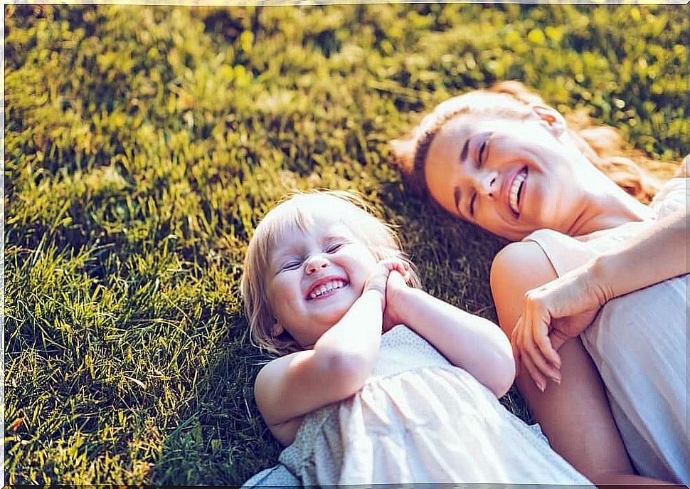 Woman with her daughter with smile